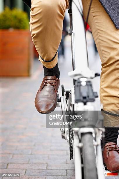 modern office worker on bicycle - bike pedal stock pictures, royalty-free photos & images