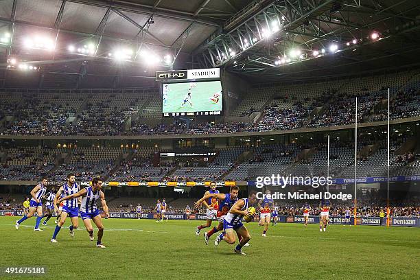 Brent Harvey of the Kangaroos runs with the ball during the round nine AFL match between the North Melbourne Kangaroos and the Brisbane Lions at...