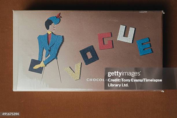 Box of Cadbury's Vogue chocolate illustrated with a lady in a fashionable jacket, circa 1950.