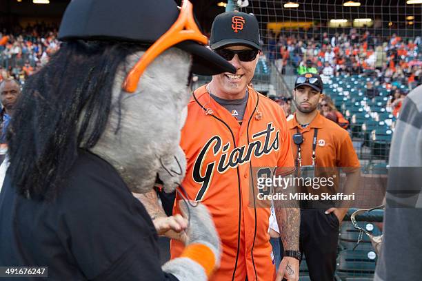 Vocalist James Hetfield of Metallica and San Francisco Giants mascot Lou Seal bond before the National Anthem at AT&T Park on May 16, 2014 in San...