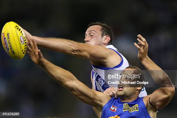 Todd Goldstein of the Kangaroos and Trent West of the Lions contest for the ball during the round nine AFL match between the North Melbourne...