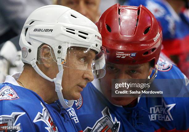 Russian President Vladimir Putin attends a Night Hockey League ice hockey match with former NHL player Vyacheslav Fetsiov on October 7, 2015 in...