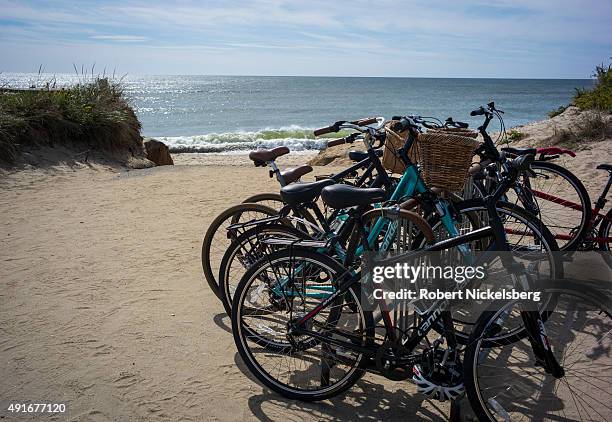 Bicycles are parked in a rack September 25, 2015 near the popular Madaket Beach on Nantucket Island, Massachusetts. Madaket Beach is the western most...