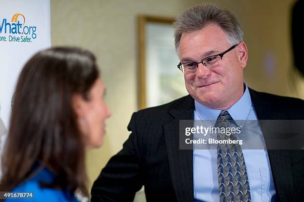 Daniel McGehee, director of the transportation and vehicle safety program at the University of Iowa, right, talks to Deborah Hersman, president and...