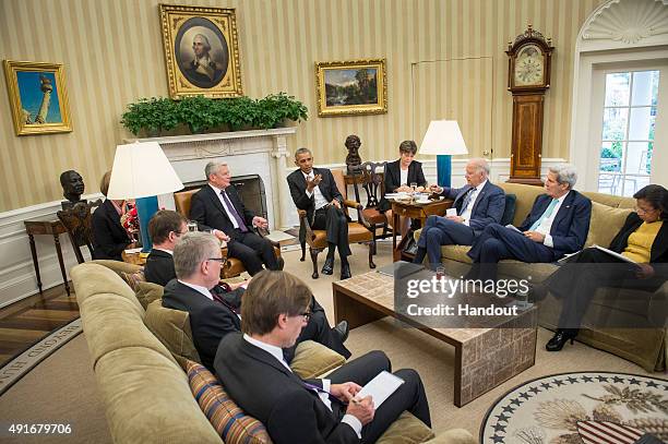 In this handout photo provided by the German Government Press Office , US President Barack Obama and German President Joachim Gauck speak to Vice...