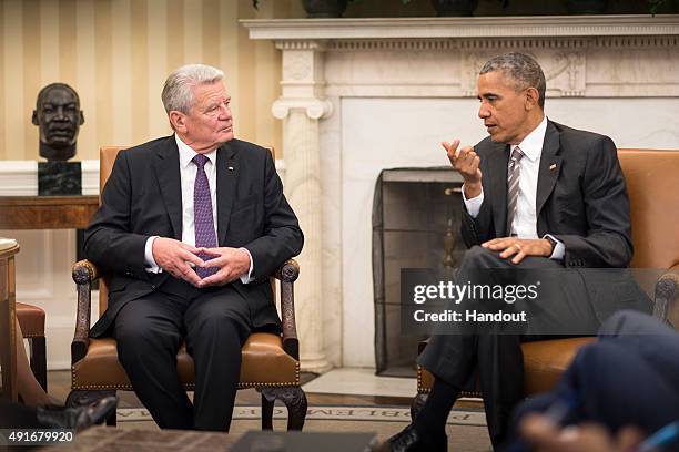 In this handout photo provided by the German Government Press Office , US President Barack Obama and German President Joachim Gauck talk during a...