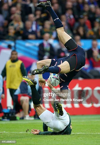 Bryan Habana of South Africa collides with Blaine Scully of the United States challenging for the arial ball during the 2015 Rugby World Cup Pool B...