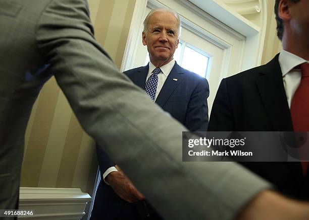 Vice President Joseph Biden attends a meeting with US President Barack Obama and German President Joachim Gauck in the Oval Office at the White House...