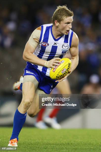 Jack Ziebell of the Kangaroos runs with the ball during the round nine AFL match between the North Melbourne Kangaroos and the Brisbane Lions at...