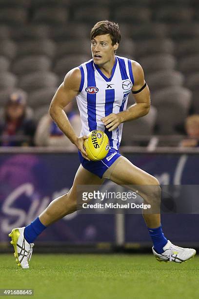 Joel Tippett of the Kangaroos runs with the ball during the round nine AFL match between the North Melbourne Kangaroos and the Brisbane Lions at...