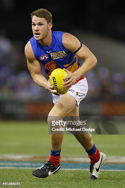 Jack Redden of the Lions looks ahead with the ball during the round nine AFL match between the North Melbourne Kangaroos and the Brisbane Lions at...