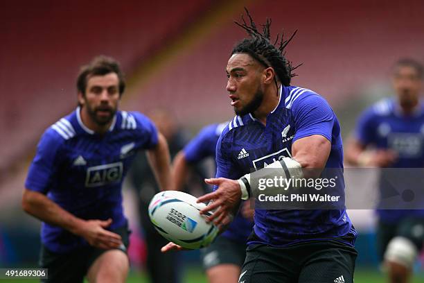 Maa Nonu of the All Blacks passes during a New Zealand All Blacks training session at Mowden Park on October 7, 2015 in Darlington, United Kingdom.