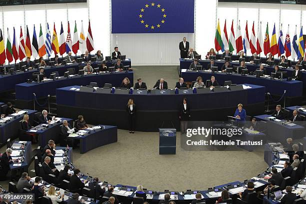 Germany's Chancellor Angela Merkel speaks as French president Francois Hollande listens during their joint speech to the members of the European...