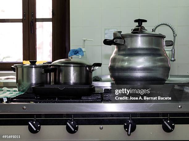 restaurant kitchen with a pressure cooker industry - pressure cooker stock pictures, royalty-free photos & images