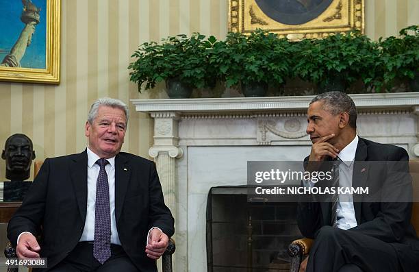 President Barack Obama meets with German President Joachim Gauck in the Oval Office at the White House in Washington, DC, on October 7, 2015. AFP...