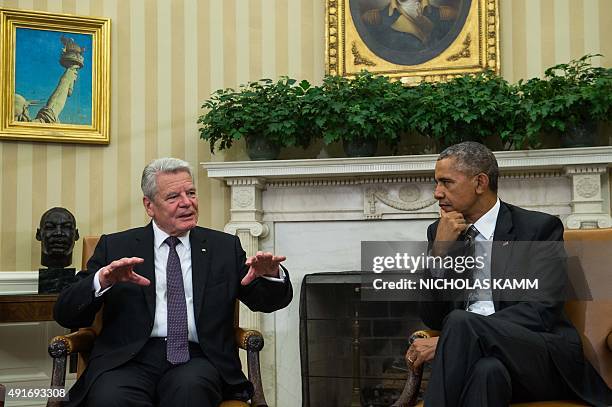 President Barack Obama meets with German President Joachim Gauck in the Oval Office at the White House in Washington, DC, on October 7, 2015. AFP...
