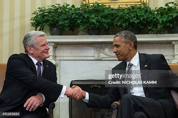 President Barack Obama meets with his German counterpart Joachim Gauck in the Oval Office at the White House in Washington, DC, on October 7, 2015....