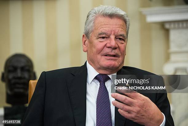 German President Joachim Gauck speaks during a meeting with US President Barack Obama in the Oval Office at the White House in Washington, DC, on...