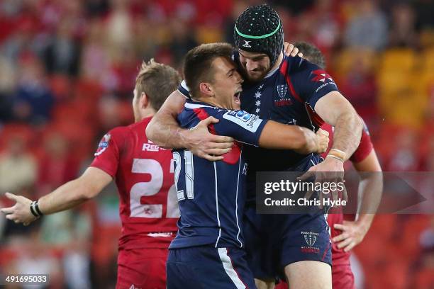 Ben Meehan and Hugh Pyle of the Rebels celebrate winning the round 14 Super Rugby match between the Reds and the Rebels at Suncorp Stadium on May 17,...