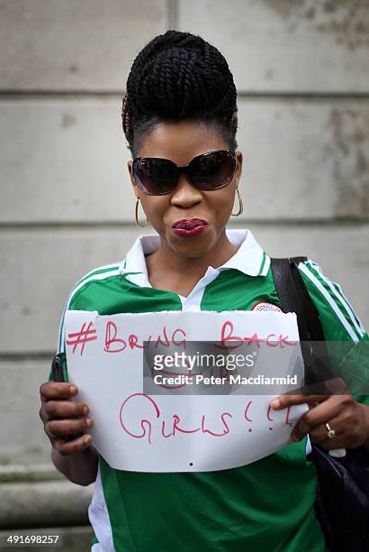 Supporter calling for the release of schoolgirls abducted by Boko Haram Islamists stands outside the Nigerian embassy on May 17, 2014 in London,...