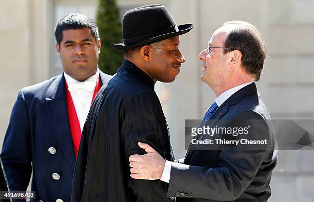 French President Francois Hollande welcomes Nigeria's President Goodluck Jonathan , upon his arrival to an African security summit on May 17 at the...