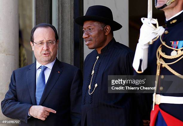 French President Francois Hollande welcomes Nigeria's President Goodluck Jonathan , upon his arrival to an African security summit on May 17 at the...