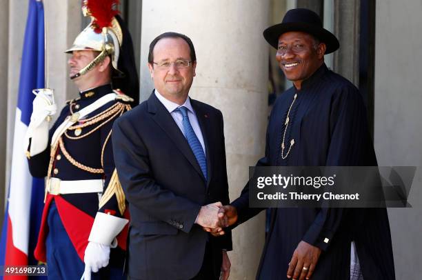 French President Francois Hollande welcomes Nigeria's President Goodluck Jonathan , upon his arrival to an African security summit on May 17 at the...