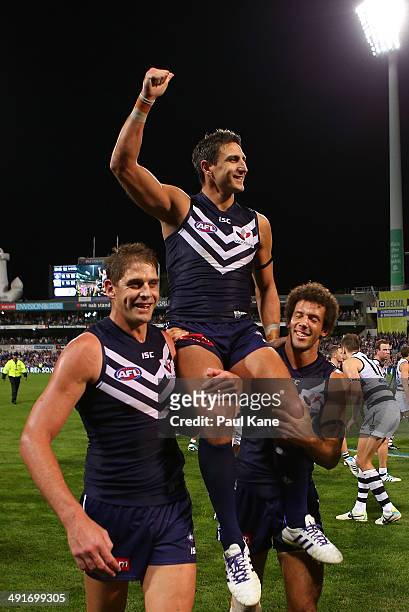 Matthew Pavlich of the Dockers is chaired from the ground by Aaron Sandilands and Zac Clarke after playing his 300th game and winning the round nine...