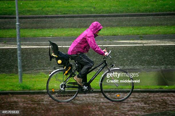 biker in the rain - clothing isolated stockfoto's en -beelden