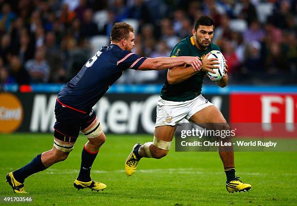 Damian De Allende of South Africa evades a tackle from during the Matthew Trouville of the United States 2015 Rugby World Cup Pool B match between...