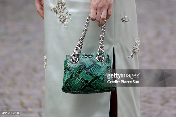 Mackenzie Davis, handbag detail, arrives at the Miu Miu show as part of the Paris Fashion Week Womenswear Spring/Summer 2016 on October 7, 2015 in...