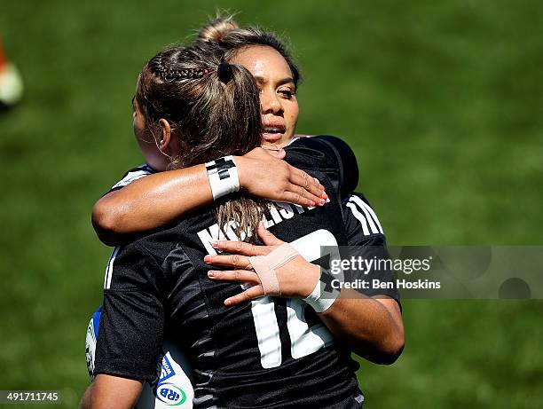 Kayla McCalister of New Zealand is congratulated by Huriana Manuel after scoring a try during the IRB Women's Sevens World Series match between New...