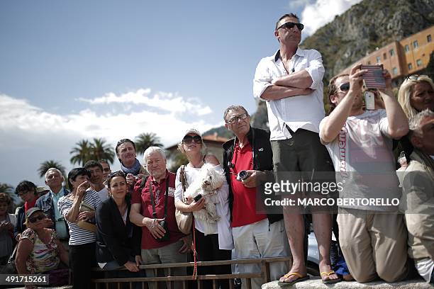 People wait for the arrival of Jerome Kerviel near the French border on May 17, 2014 outside Vintimille . Jerome Kerviel, facing prison on his return...