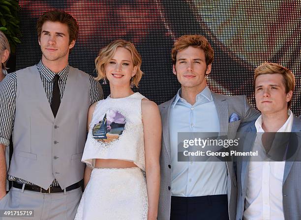 Actors Liam Hemsworth, Jennifer Lawrence, Sam Claflin, Josh Hutcherson attend 'The Hunger Games: Mockingjay Part 1' photocall at the 67th Annual...