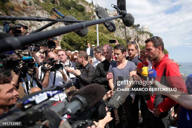 Former trader Jerome Kerviel speaks to the press flanked by his lawyer David Koubbi as he arrives near the French border on May 17, 2014 outside...