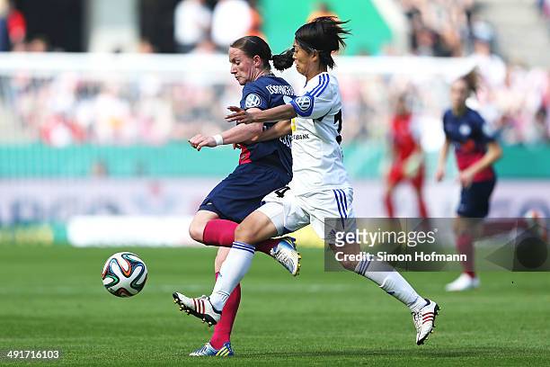 Sabrina Doerpinghaus of Essen is challenged by Kozue Ando of Frankfurt during the Women's DFB Cup Final between SGS Essen and 1. FFC Frankfurt at...