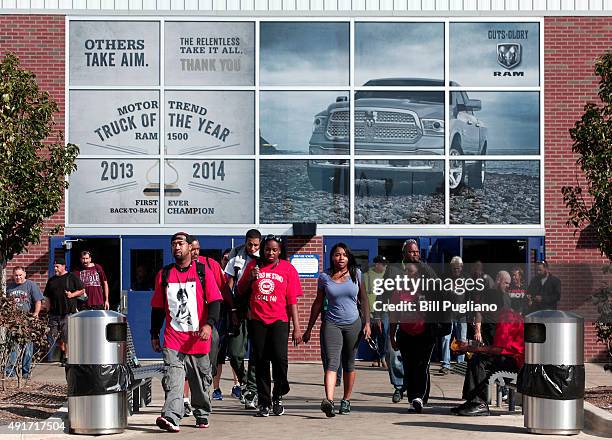 Fiat Chrysler Automobile workers exit from the Warren Truck Assembly Plant at the end of their shift October 7, 2015 in Warren, Michigan. The United...