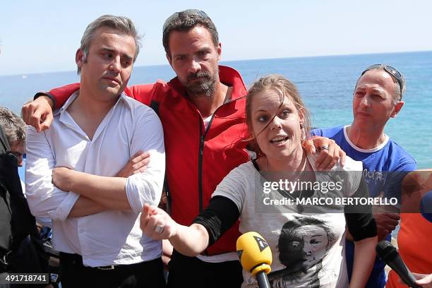 Former trader Jerome Kerviel gives a press conference with supporters as he arrives near the French border on May 17, 2014 outside Vintimille ....