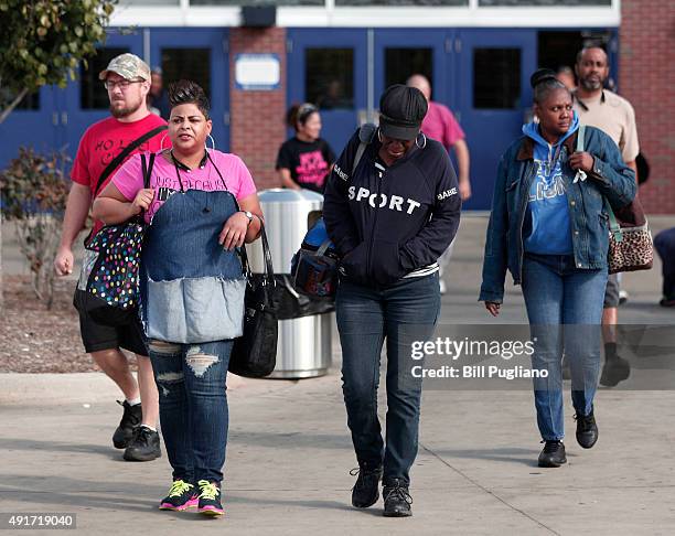 Fiat Chrysler Automobile workers exit from the Warren Truck Assembly Plant at the end of their shift October 7, 2015 in Warren, Michigan. The United...