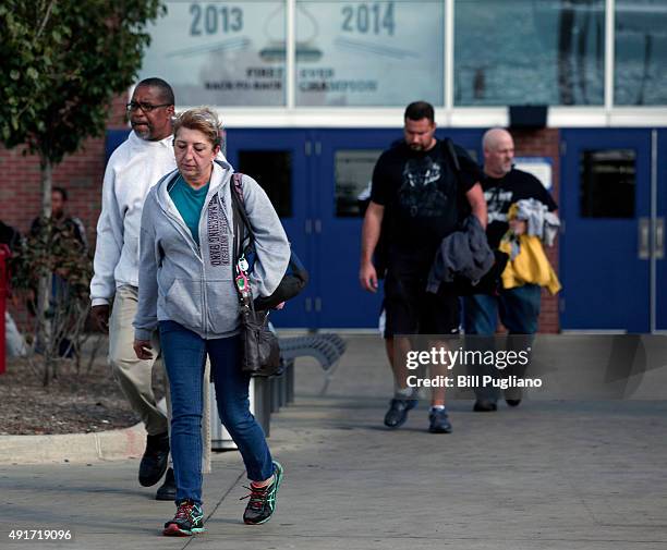 Fiat Chrysler Automobile workers exit from the Warren Truck Assembly Plant at the end of their shift October 7, 2015 in Warren, Michigan. The United...