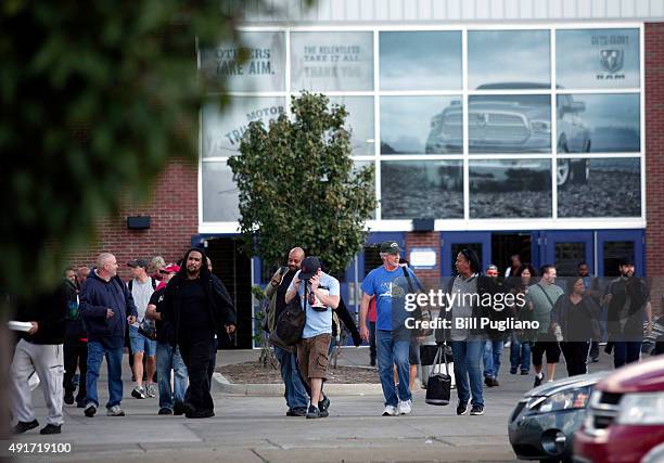 Fiat Chrysler Automobile workers exit from the Warren Truck Assembly Plant at the end of their shift October 7, 2015 in Warren, Michigan. The United...