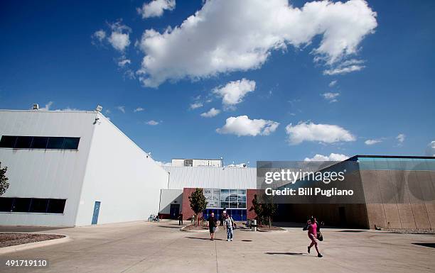 Fiat Chrysler Automobile workers exit from the Warren Truck Assembly Plant at the end of their shift October 7, 2015 in Warren, Michigan. The United...