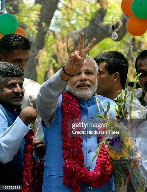 Prime ministerial candidate Narendra Modi along with party senior leaders arrive to attend BJP parliament board meeting, after his party's landslide...