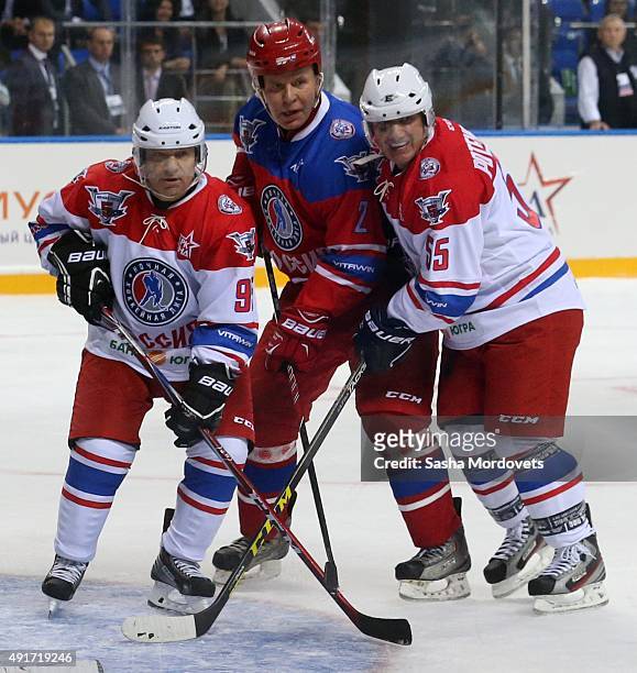 Russian billionaires and businessmen Arkady Rotenberg , his brother Boris Rotenber and former NHL player Vyacheslav "Slava" Fetisov attend an ice...