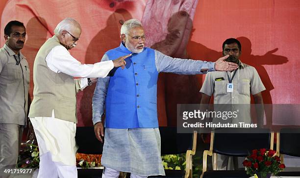 Prime ministerial candidate Narendra Modi and party senior leader LK Advani during the BJP parliament board meeting, after party's landslide victory...
