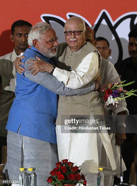 Prime ministerial candidate Narendra Modi and party senior leader LK Advani during the BJP parliament board meeting, after party's landslide victory...