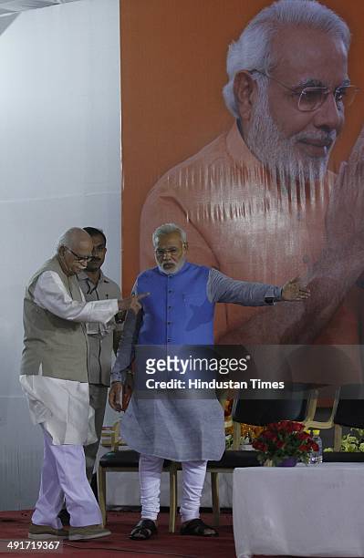 Prime ministerial candidate Narendra Modi along with senior leader LK Advani during the BJP parliament board meeting, after party's landslide victory...