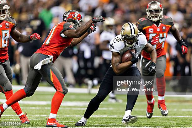 Marques Colston of the New Orleans Saints is tackled by Alterraun Verner of the Tampa Bay Buccaneers at Mercedes-Benz Superdome on September 20, 2015...