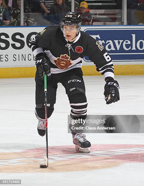 Nikita Zadorov of the London Knights skates with the puck against the Val'Dor Foreurs in Game One of the 2014 Mastercard Memorial Cup at Budweiser...