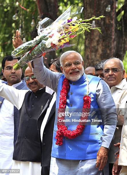 Prime ministerial candidate Narendra Modi along with party senior leaders arrive to attend BJP parliament board meeting, after his party's landslide...